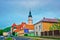 Road view with Church spire and traffic in Teplice