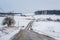 Road and view of snow covered farms and rolling hills, near Jeff