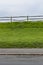 Road Walkway Grass Fence Sky