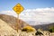 Road warning sign informing about rock slide area