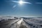 Road on the Wasserkuppe in winter with lots of snow and sun