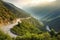 road winding through the mountains, with stunning scenery in every direction