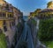 The road winds down to the harbour through a cleft in the cliff line in Sorrento, Italy on the Amalfi coast