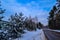 Road in winter on the lake outside the city.