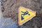 Road work sign under construction.Caution symbol.Yellow triangle safety sign warns about roadworks. Yellow safety sign warns about