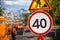 Road work and speed limit signs