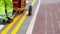 Road worker painting yellow street lines on road in the UK