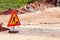Road works sign for construction works, road, pavement construction. Traffic, warning sign road repairing, road maintenance.