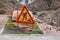 Road works sign, hazardous area fencing. Communal accident, pits and embankments, photo