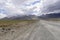 Road in Zanskar landscape view with Himalaya mountains covered with snow and blue sky in Jammu & Kashmir, India