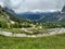 Roadbikers on dolomite mountain roadpass uphill on gardena road pass