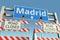 Roadblock at Madrid city traffic sign. Coronavirus disease quarantine or lockdown in Spain conceptual 3D rendering