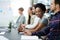 Roads that lead to success pass through hard work first. Portrait of a businesswoman sitting with her colleagues in a