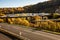 Roads and rail network through the autumn forest