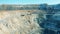 Roads and snowy slopes of an open-pit mine