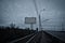 Roadside abandoned banner blank against dark cloudy sky