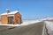 Roadside chapel and snowy vineyards. Piedmont, Italy.