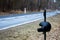 A roadside cross with a motorcycle helmet commemorating the tragic death of a motorcyclist.