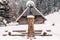 Roadside shrine in winter scenery, Tatra Mountains, Poland