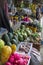 A roadside stall selling watermelons, sweet potatoes, papayas, pineapples and other locally harvested fruits.