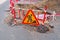 Roadsigns on the urban asphalt road.