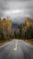 Roadway leading to a mountain in New Hampshire, USA covered with snow in the fall