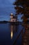 Roanoke River lighthouse reflecting in the water at dusk