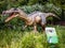 Roaring Baryonyx standing in tall grass display model in Perth Z