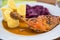 Roast chicken thigh, stewed red cabbage and sliced potato dumpling