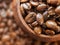 Roast coffee beans in a wooden bowl