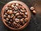 Roast coffee beans in a wooden bowl
