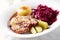 Roast pork chop with potato dumplings and red cabbage