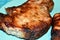 Roast pork steak with bone on a plate background