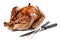 Roast turkey with carving fork and knife