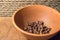 Roasted Arabica Coffee Beans in a Clay Bowl