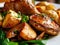 Roasted boletus, Fried ceps, porcini mushrooms with baked potatoes and greens on restaurant plate