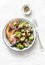 Roasted brussels sprouts with bacon on a light background, top view. Delicious appetizers