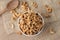 Roasted cashew nuts and halves in wooden bowl on table top view. Macro studio shot Homemade Roasted Salted Cashews in basket and