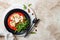 Roasted cauliflower steak with red pepper romesco sauce and arugula salad.