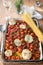 Roasted Cherry Tomatoes, Garlic, Thyme on White Baking Tray. Ingredients for Homemade Pasta Sauce