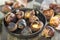 Roasted chestnuts closeup in a frying pan.