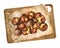 Roasted chestnuts on paper and wooden board. Watercolor illustration