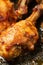 Roasted chicken legs with aromatic crust, baked meat on a oven tray, tasty food close view