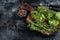 Roasted chickpeas veggie vegetable falafel patty on a rustic plate. Black background. Top view. Copy space