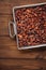 roasted cocoa chocolate beans in Vintage heavy cast aluminum roasting pan