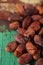 Roasted cocoa chocolate beans on wood background