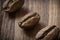 Roasted cofee beans macro on wooden background