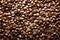 Roasted coffee beans backgound, copy space, top view. Cappuccino, dark espresso, aroma black caffeine drink, ingredient