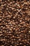 Roasted coffee beans backgound, copy space, top view. Cappuccino, dark espresso, aroma black caffeine drink, ingredient