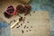 Roasted coffee beans in a pink zinc bucket on a sackcloth background.